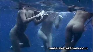 Three girls swimming nude on touching the sea